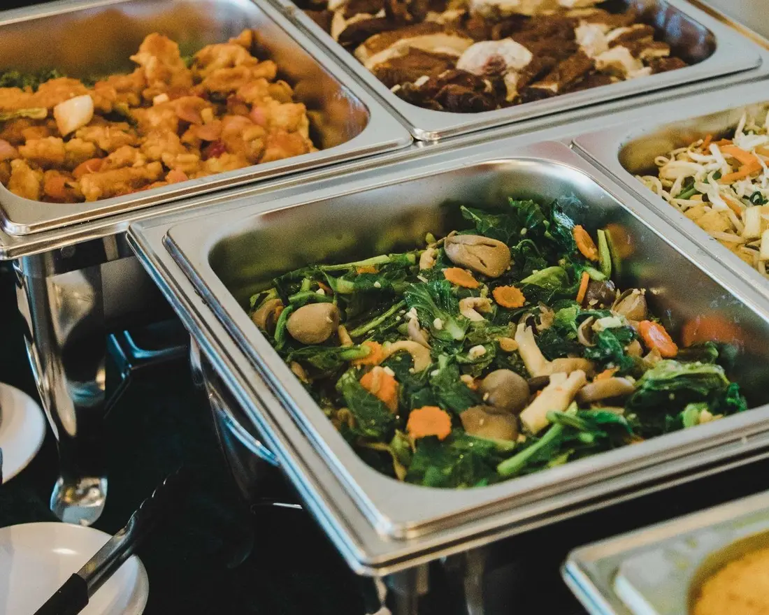 Buffet catering dishes laid out showing different menu levels in Singapore