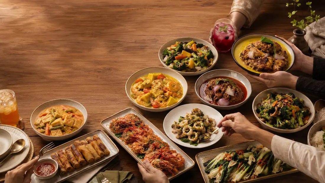 Food for a gathering laid out on a shared table in Singapore