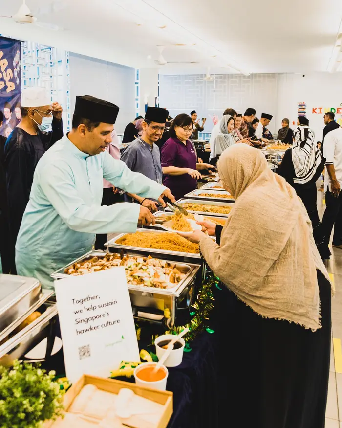 Guests serving themselves at a halal buffet catering corporate event in Singapore