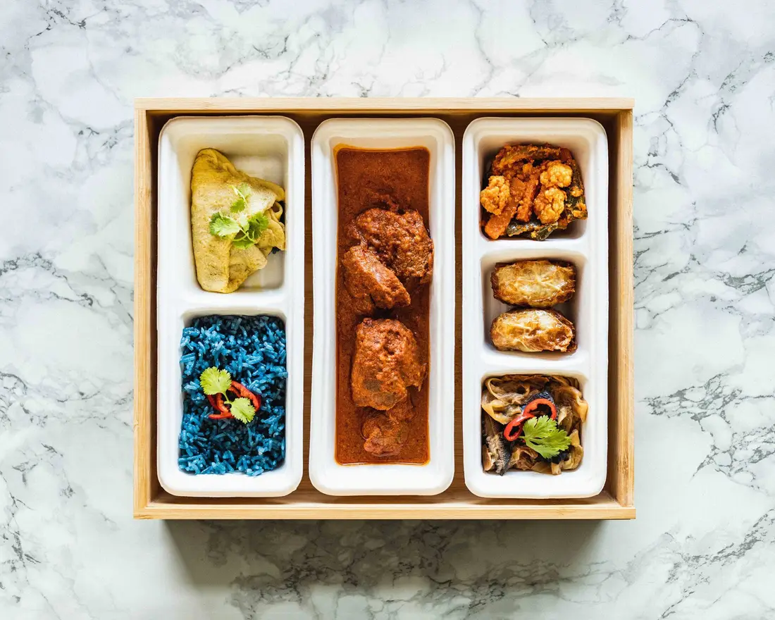 Halal bento set with beef rendang and rice packed for delivery in Singapore