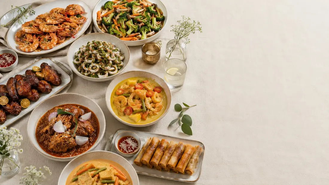 Overhead view of a mini buffet catering spread of local dishes for 40 people in Singapore
