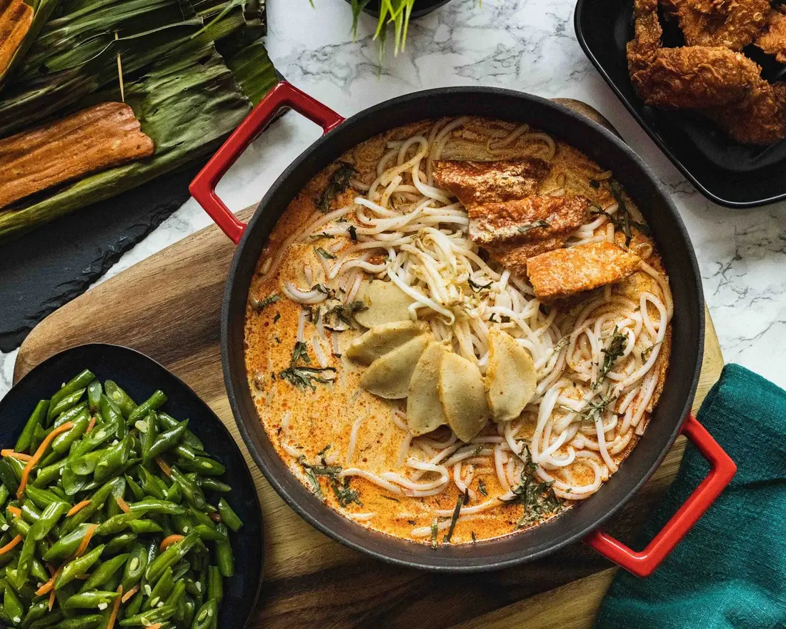 Laksa served as part of a local favourites catering spread in Singapore