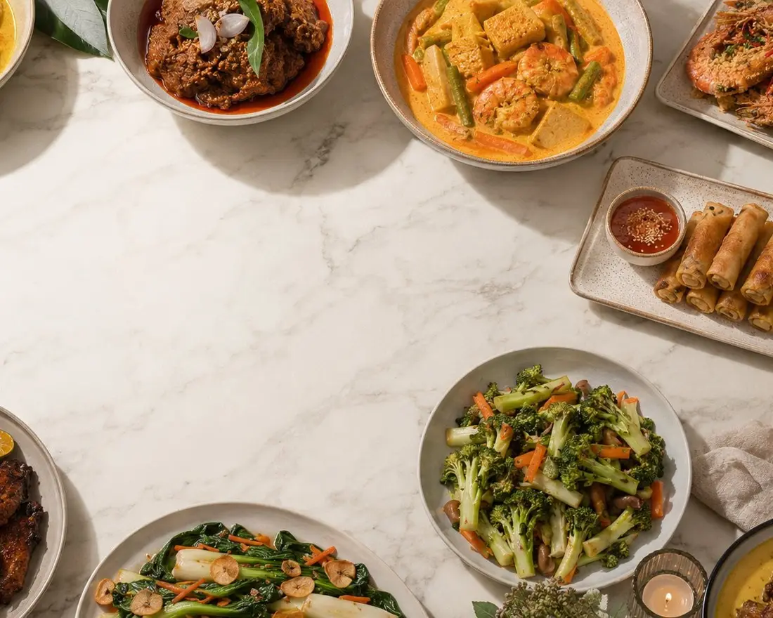 Overhead view of a mini buffet catering spread of local dishes for 30 people in Singapore